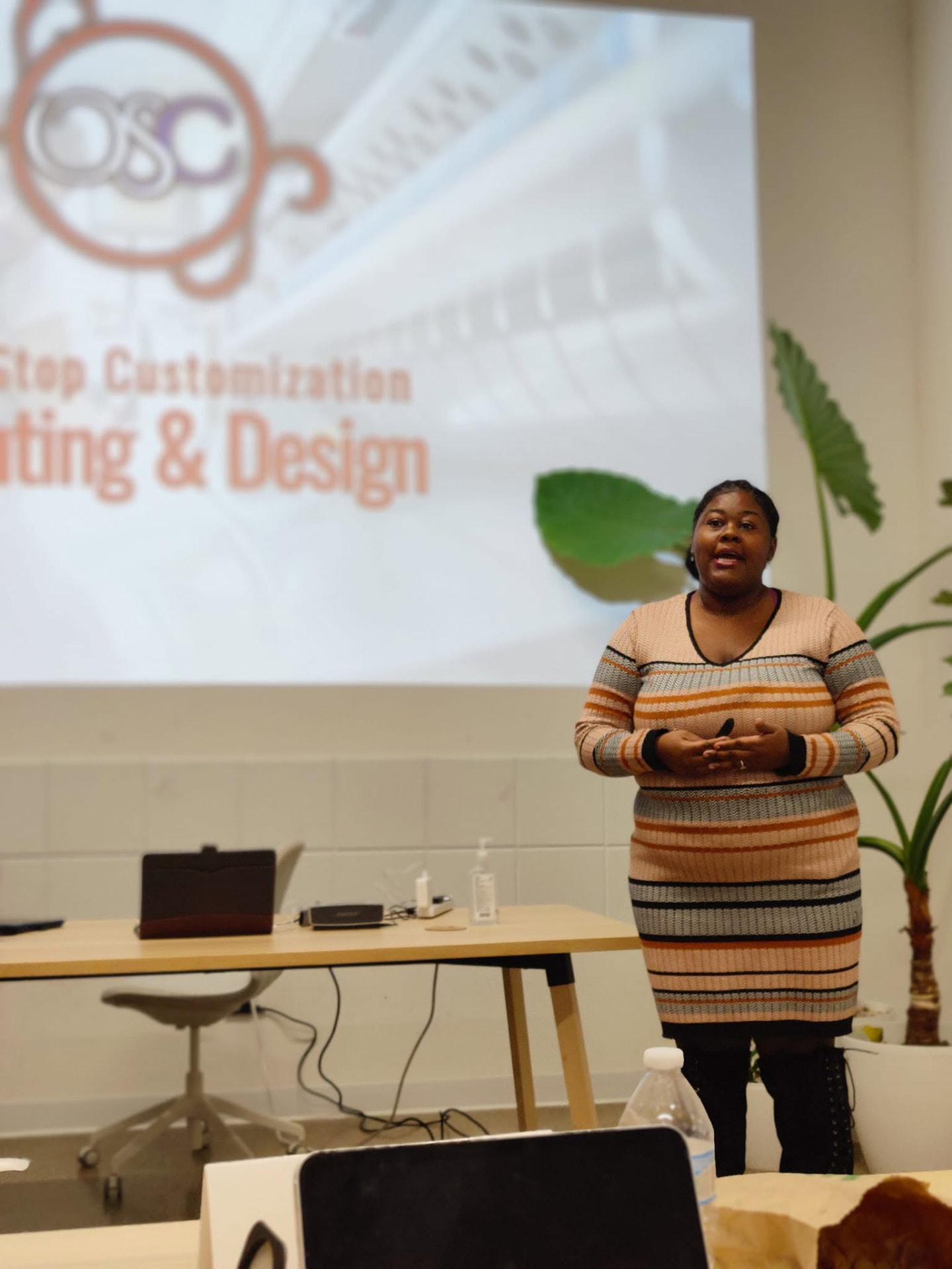 Jade presenting to a room of participants